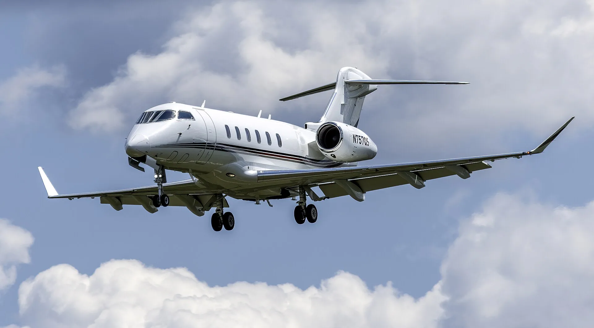 Bombardier Challenger 350 private jet on the tarmac, available for charter